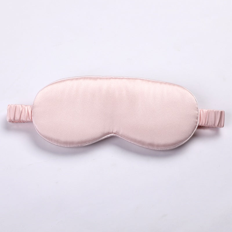 3d pink silk eye mask on a light gray background