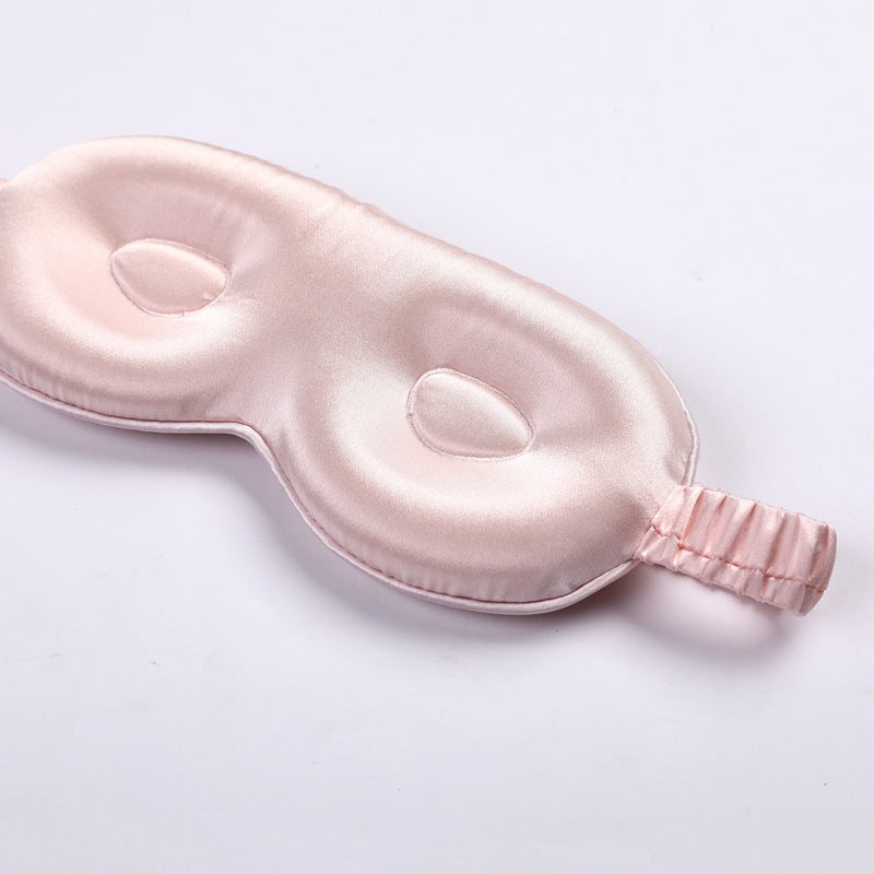 3d pink silk eye mask on a light gray background