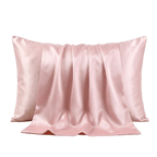 Pink silk pillowcase on a light gray background