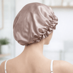 Back view of woman wearing a silk bonnet in a blurred indoor setting