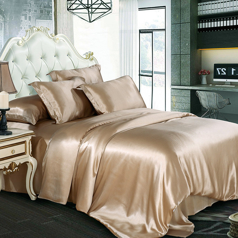 Beige silk duvet cover on a bed in a modern bedroom.