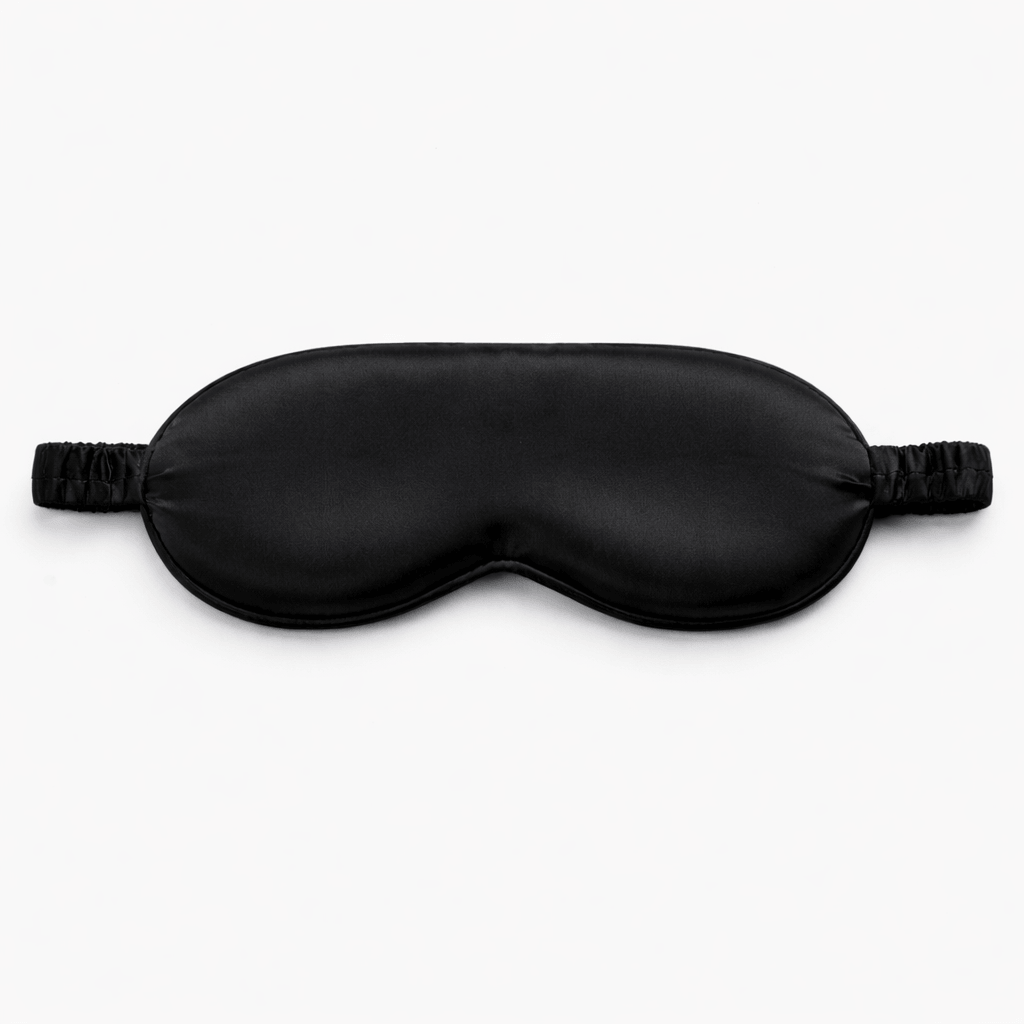 Contoured 3d black silk eye mask on a white background