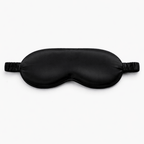 Contoured 3d black silk eye mask on a white background