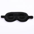 Contoured 3d black sleep mask on a white background