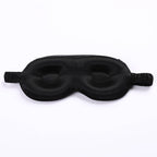 Contoured 3d black sleep mask on a white background