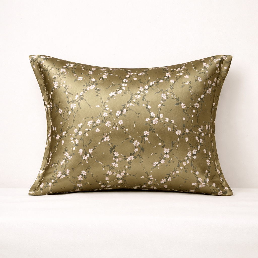 Decorative silk beige silk pillowcase with floral pattern on a white background
