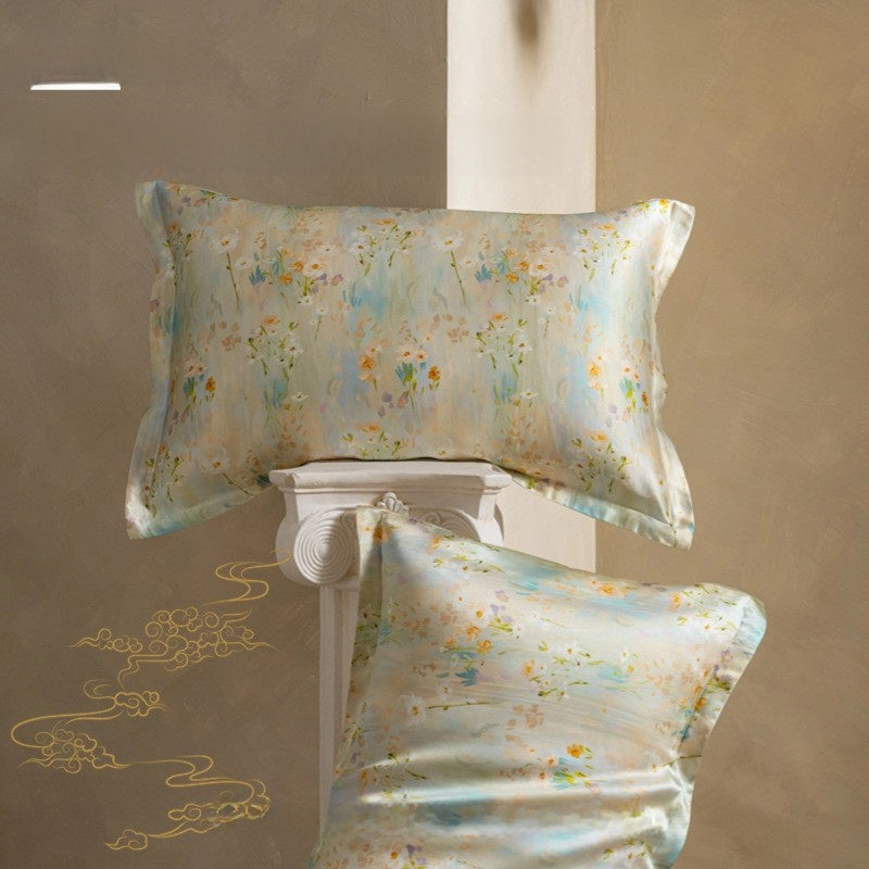 Floral patterned pillow and silk cover on a decorative stand against a beige background