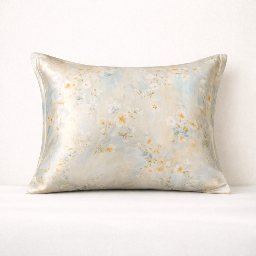 Floral patterned silk pillowcase on a pillow on a white background