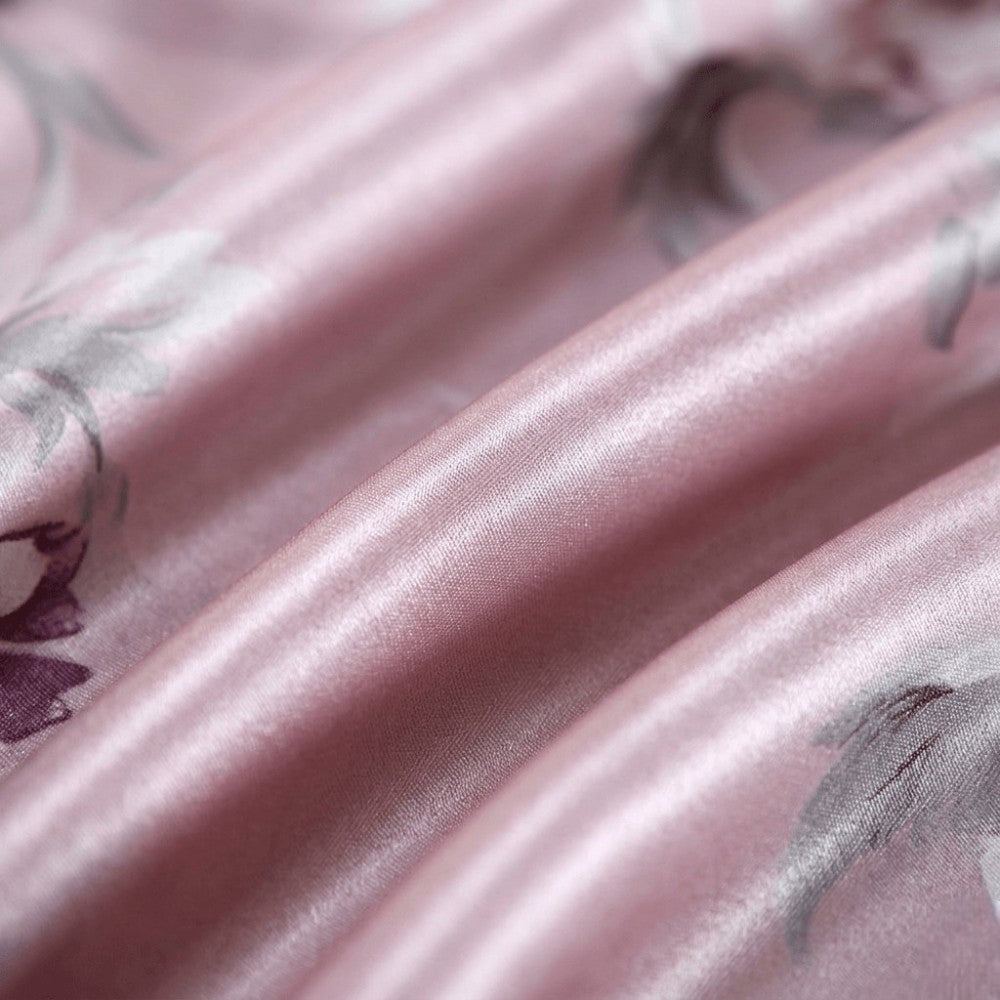 Close-up of pink silk fabric with floral patterns