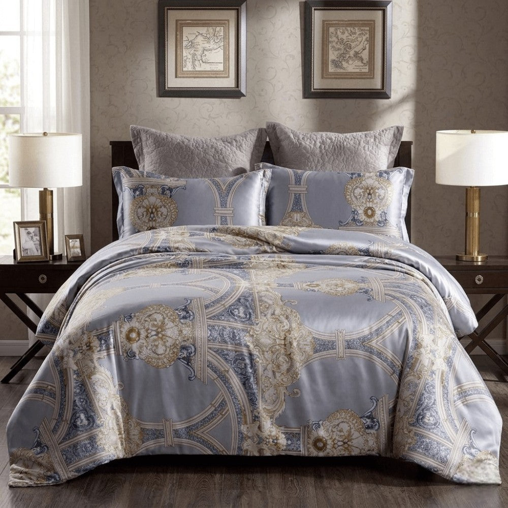 Decorative bedspread with intricate patterns on a bed in a bedroom setting.