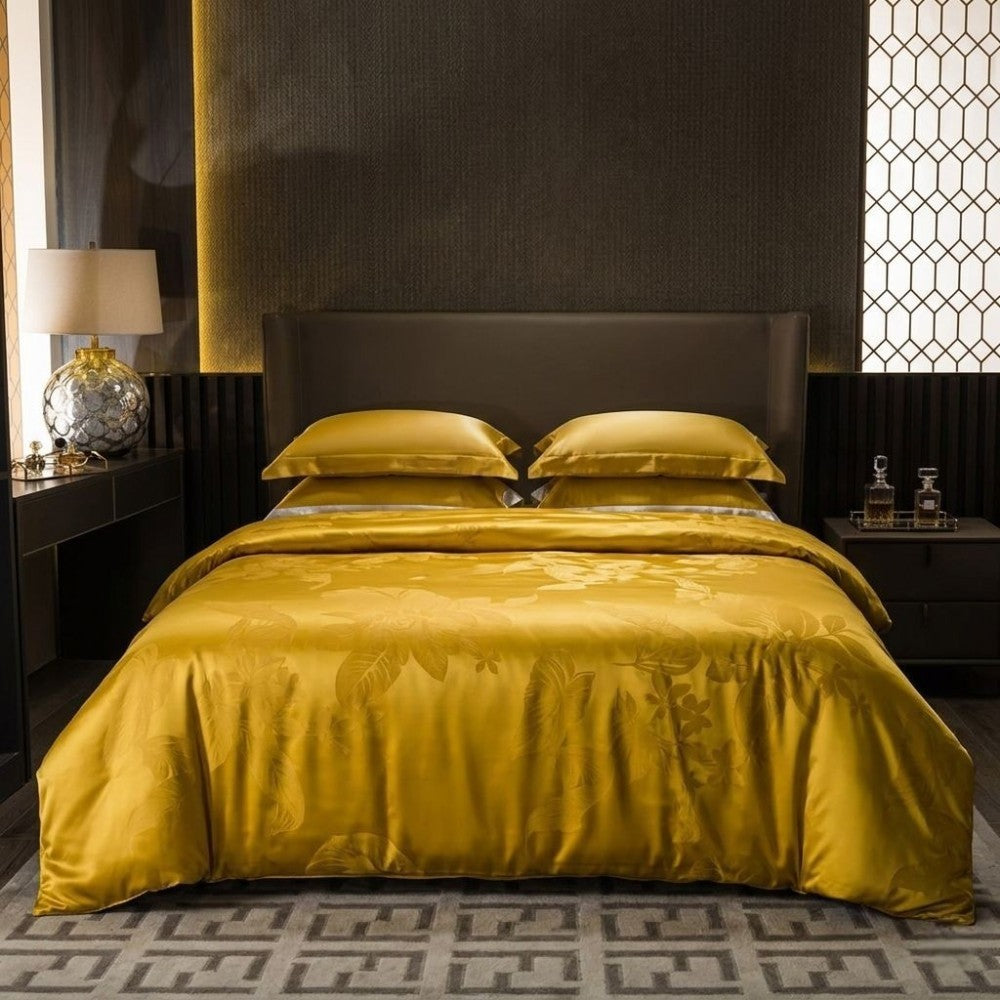 Bedroom with a bed covered in yellow bedding and dark headboard.