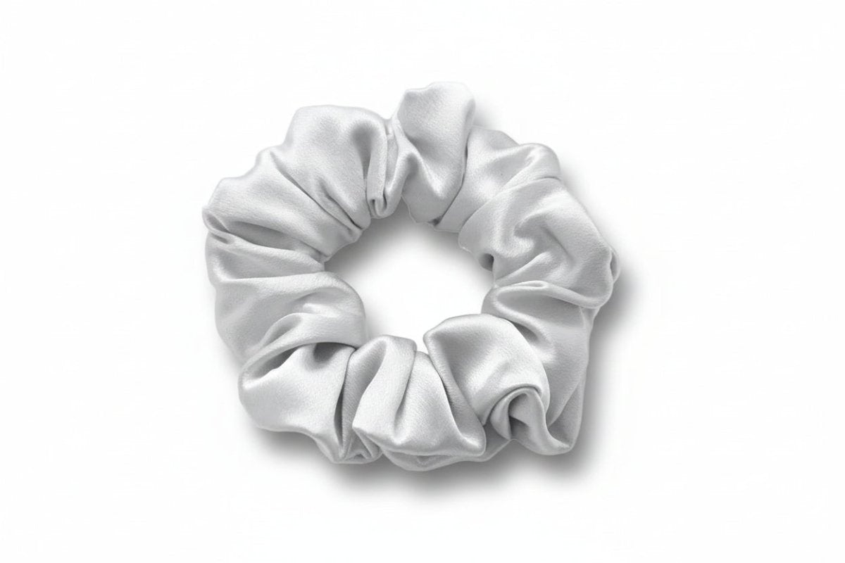 Gray silk scrunchie on a white background