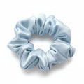 Light blue scrunchie on a white background