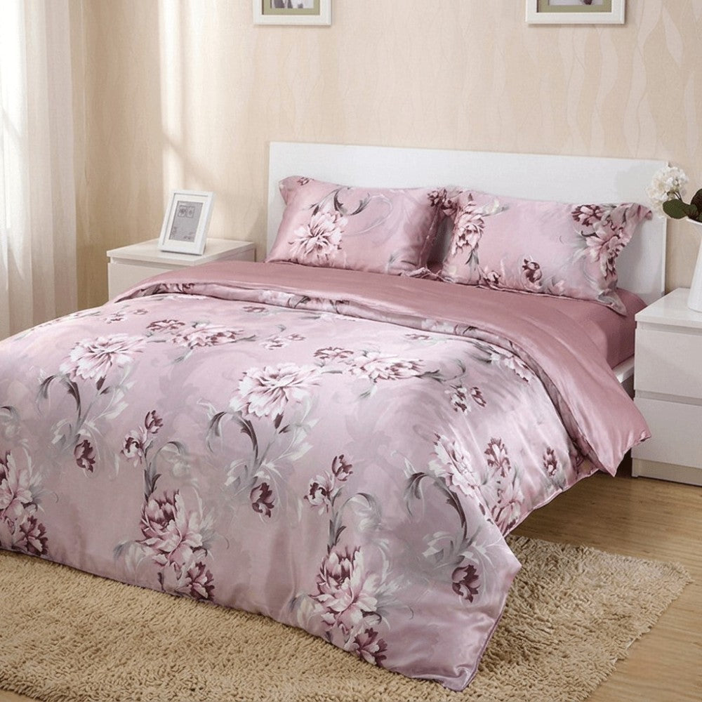 Silk floral patterned duvet cover on a bed in a bedroom setting.