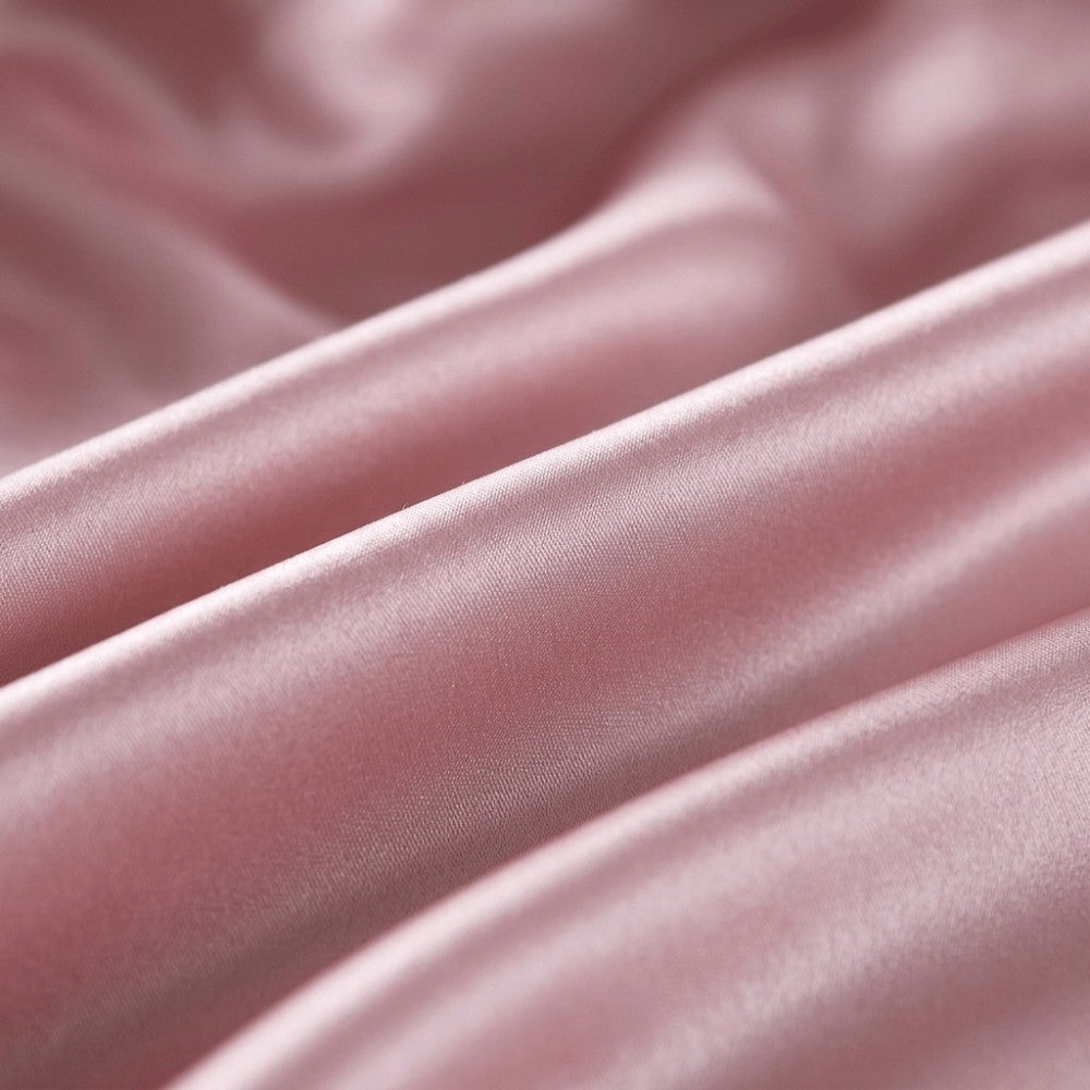 Close-up of light purple silk fabric with soft folds