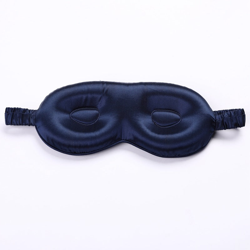 Navy blue sleep mask on a white background