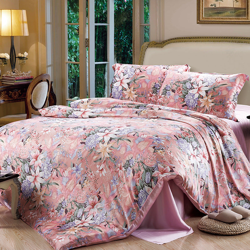 Floral silk duvet cover set on a bed in a bedroom with a lamp and window in the background.