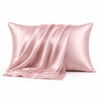 Pink silk pillowcase on a white background