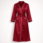 Red silk robe with white piping on a light gray background
