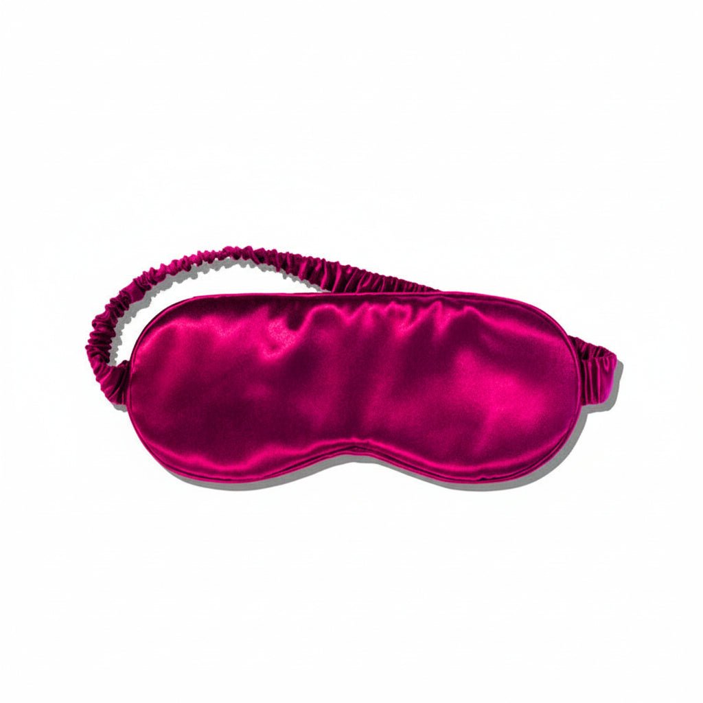 Rose pink silk sleep mask on a white background