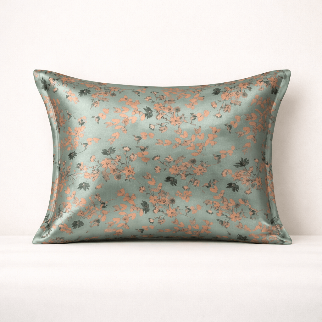 Sage green silk pilowcase with floral pattern on a white background