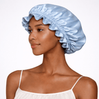 Side view of a woman wearing a blue silk bonnet on a white background