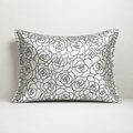 Silk pillowcase with black rose petal floral pattern on a white background