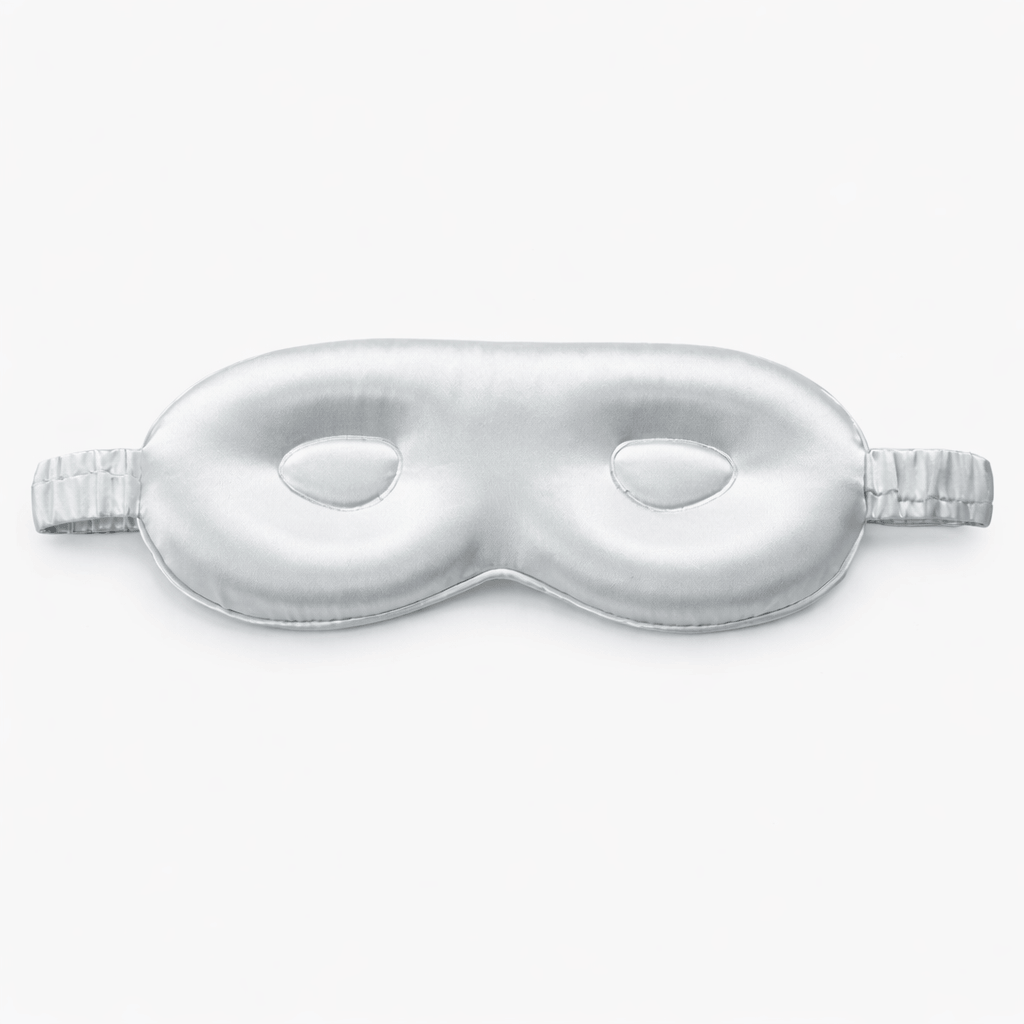 Silky silver grey sleep mask with contour on a light gray background