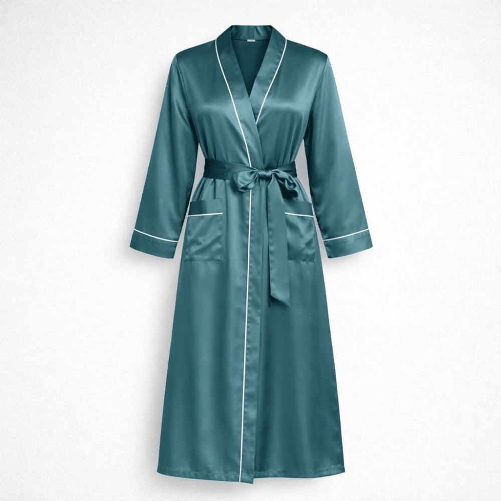 Teal silk robe with white piping on a light gray background silhouette