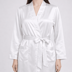 White silk robe worn by a model on a light gray background