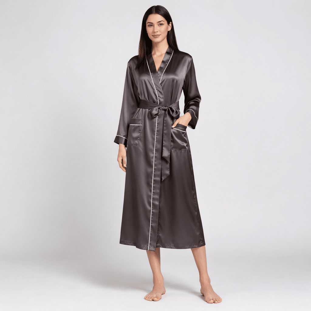 Woman wearing a long silk robe on a white background