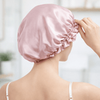 woman wearing a pink silk bonnet with a blurred indoor background