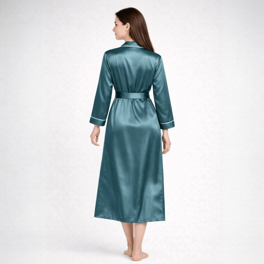 Backview of woman wearing a teal silk robe on a white background