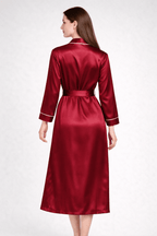 Red silk robe worn by a model on a white background