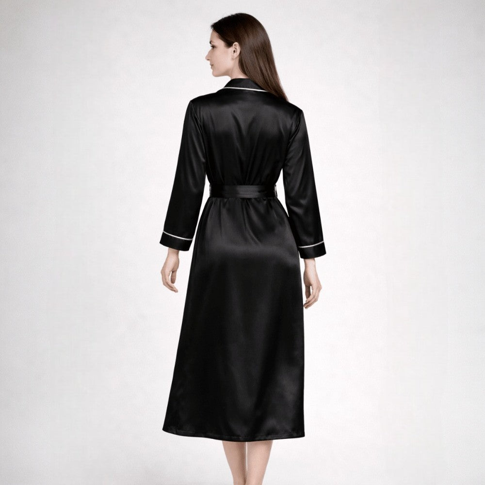 Backview of woman wearing a black silk robe on a white background