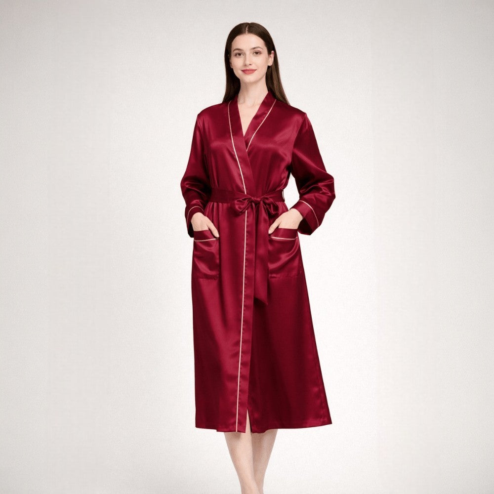 Woman wearing a red silk robe on a white background