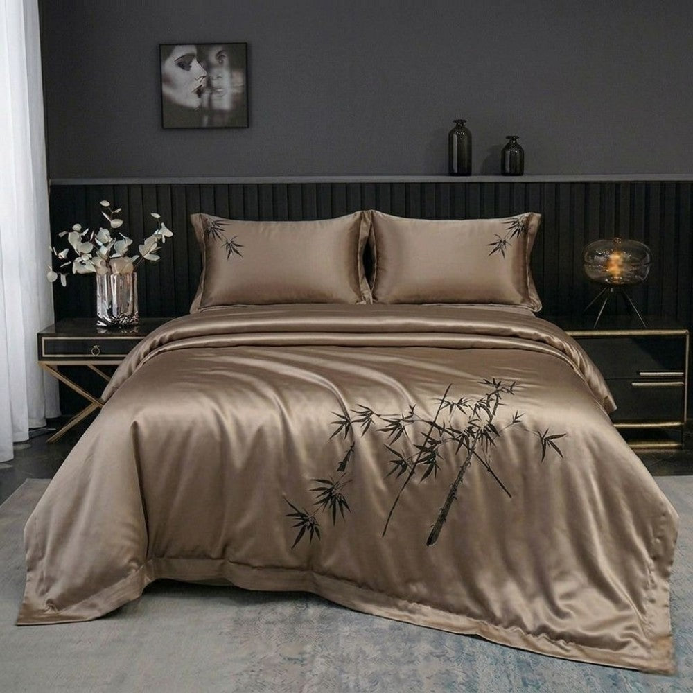 Light brown silk bedding set with bamboo design in a bedroom setting