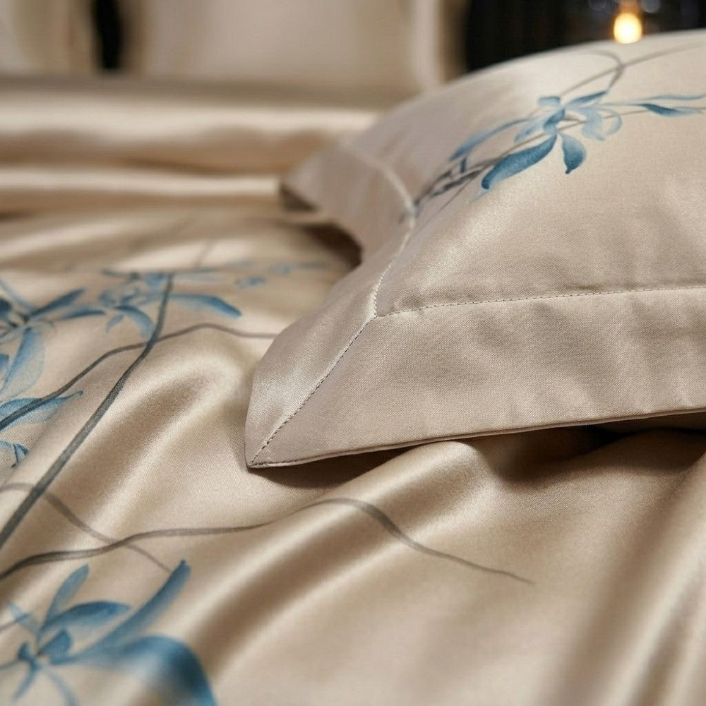 Silky satin fabric with blue floral patterns on a neutral background