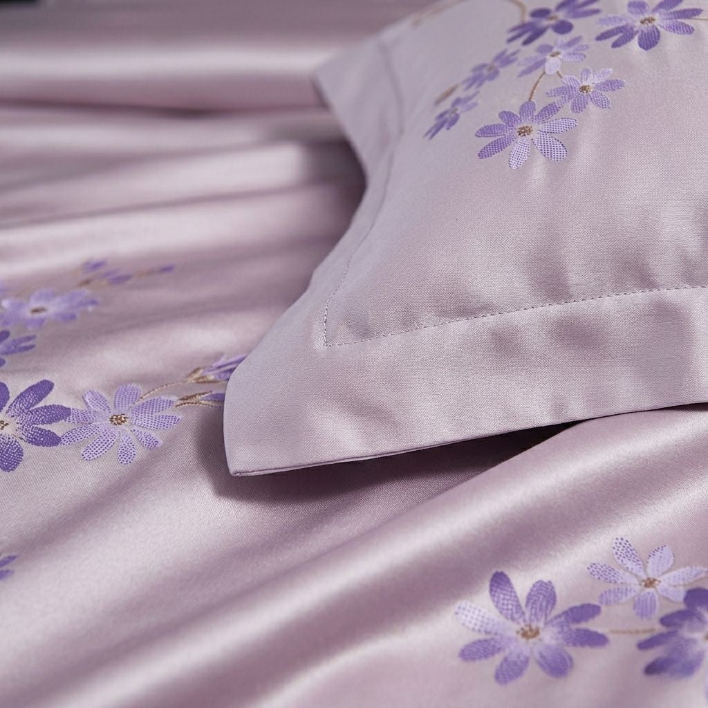 Silky fabric with purple floral embroidery