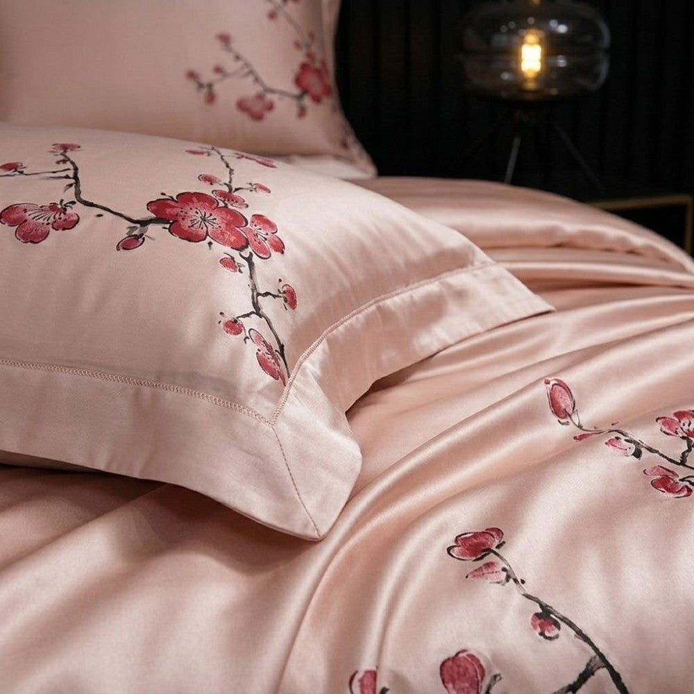 Pink bedding set with floral patterns on a dark background