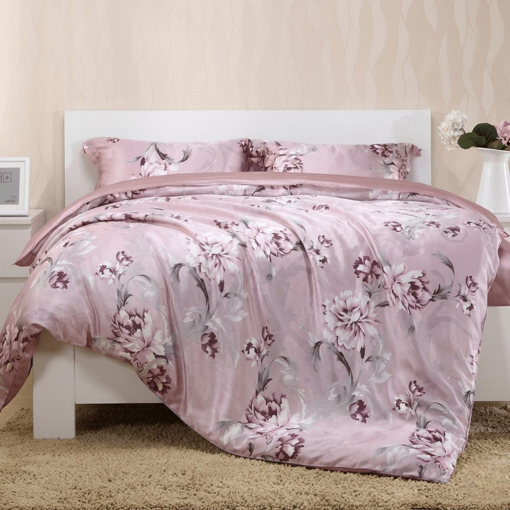 Silk floral bedding set on a bed in a bedroom setting