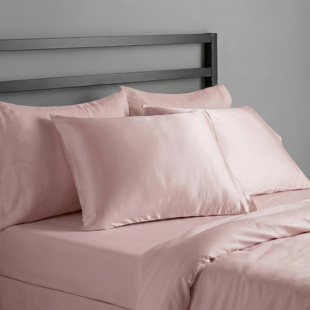 light pink mulberry silk pillowcases on bed