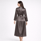 Woman wearing a long silk robe on a white background