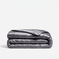 A folded dark gray silk duvet cover
