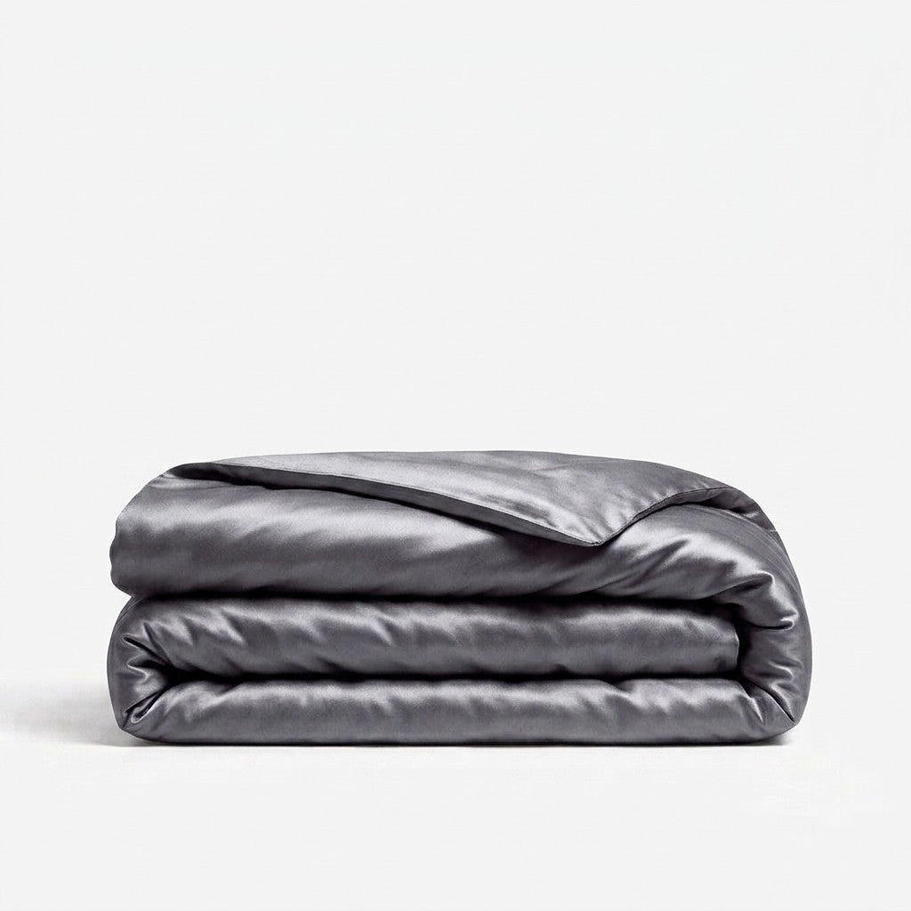 A folded dark gray silk duvet cover