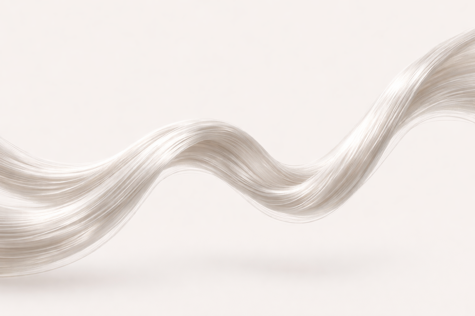 Wavy strands of silk fibre on a light gray background