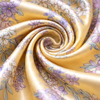 Roll of yellow fabric with floral pattern